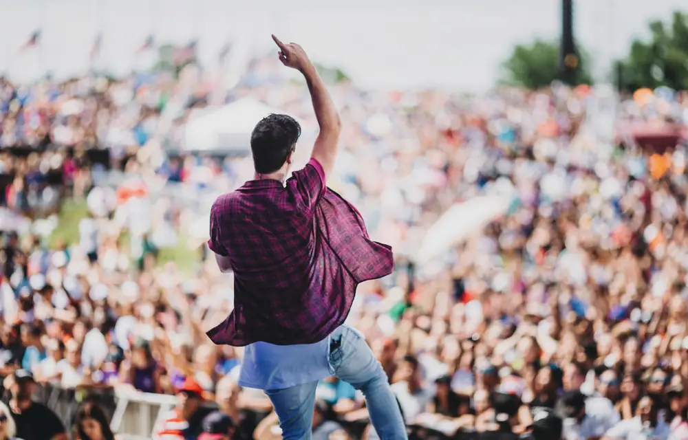 On stage before the crowd