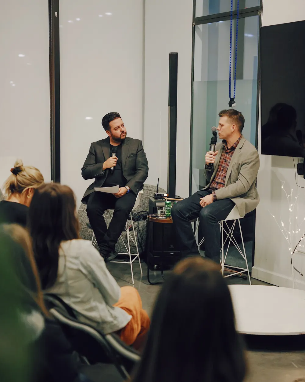 Jeremy hosting a conversation on stage
